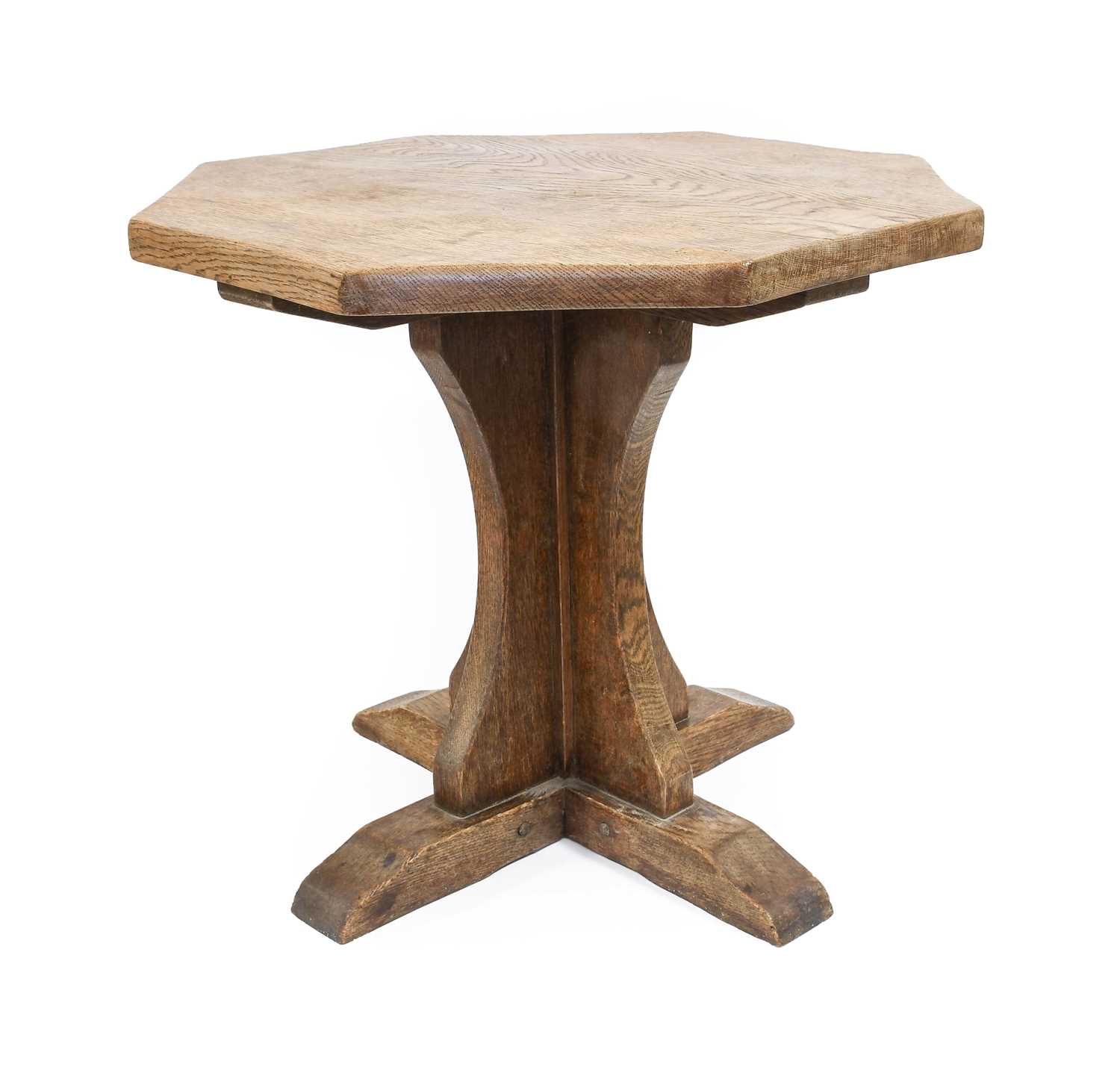 Yorkshire School: An English Oak Octagonal Coffee Table, the adzed top on a cruciform base,