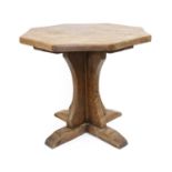 Yorkshire School: An English Oak Octagonal Coffee Table, the adzed top on a cruciform base,