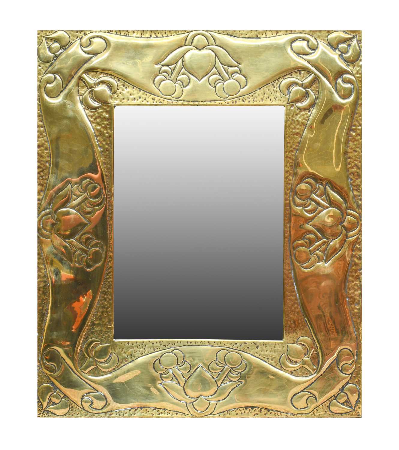 An Arts & Crafts Rectangular Brass Mirror, beaten and embossed with heart motifs and fruit, plain