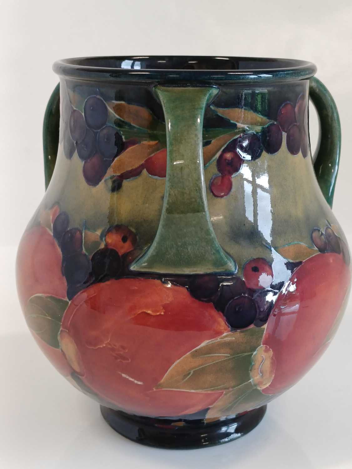 William Moorcroft (1872-1945): A Pomegranate Pattern Three-Handled Vase, on a green/blue ground, - Image 8 of 13