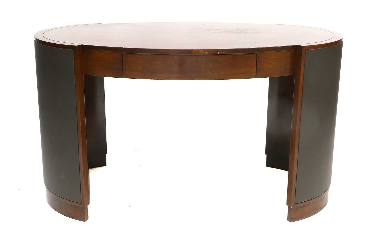 A Selva of Italy Mahogany Oval Desk, with a quarter-veneered top above a drawer, the curved end