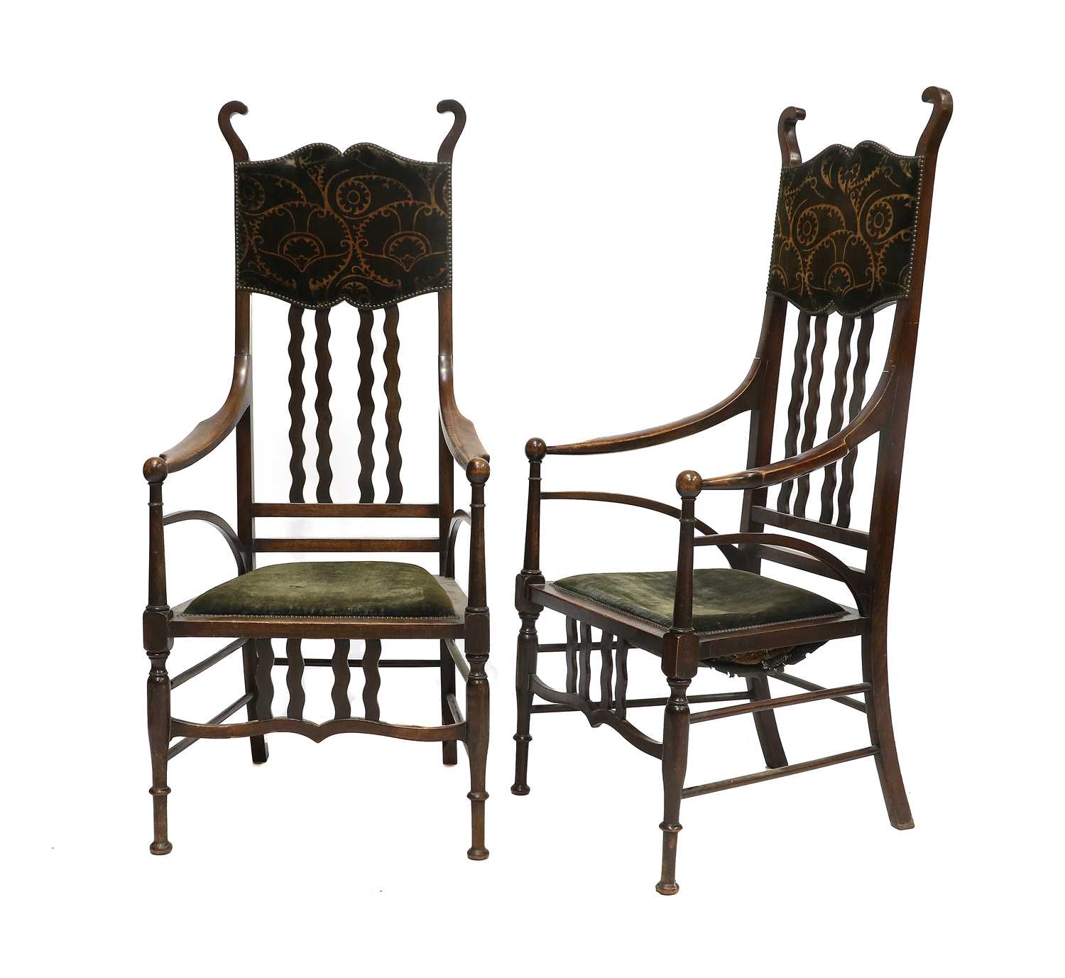 A Pair of Art Nouveau Stained Beech High Back Armchairs, attributed to J.S Henry, scroll