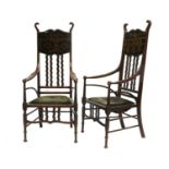 A Pair of Art Nouveau Stained Beech High Back Armchairs, attributed to J.S Henry, scroll
