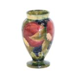 William Moorcroft (1872-1945): A Pomegranate Pattern Vase, 1914, tubeline decorated in shades of