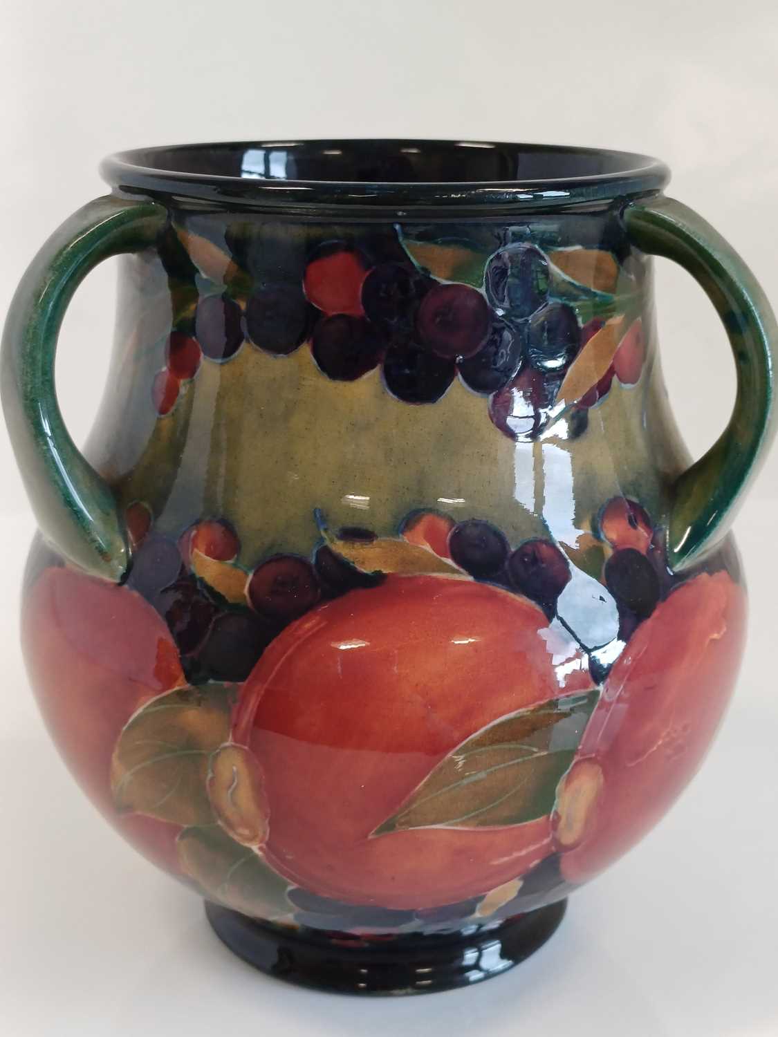 William Moorcroft (1872-1945): A Pomegranate Pattern Three-Handled Vase, on a green/blue ground, - Bild 9 aus 13