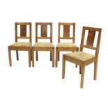 A Set of Four English Oak Dining Chairs, each with burr oak slat back panels, leather hide