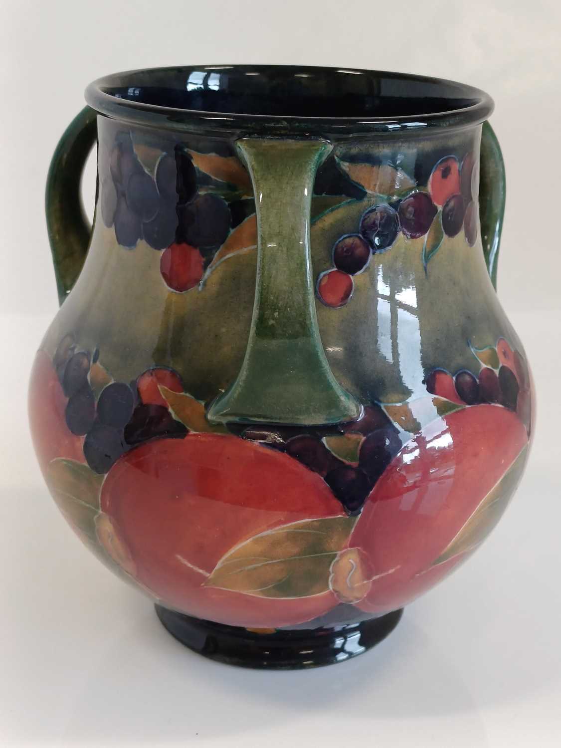 William Moorcroft (1872-1945): A Pomegranate Pattern Three-Handled Vase, on a green/blue ground, - Image 10 of 13