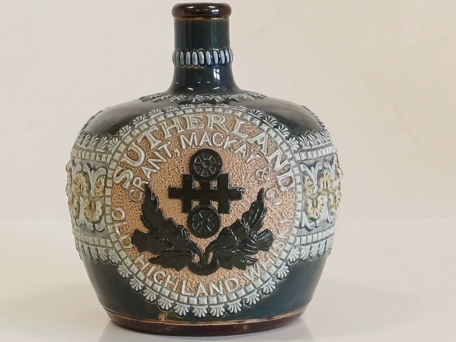 A Doulton Lambeth Stoneware Whisky Flask, circa 1898, applied thistle design and SUTHERLAND GRANT, - Image 4 of 10