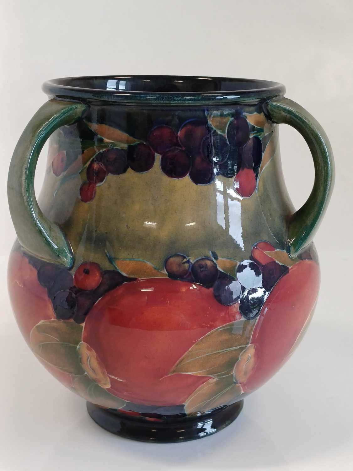 William Moorcroft (1872-1945): A Pomegranate Pattern Three-Handled Vase, on a green/blue ground, - Image 6 of 13