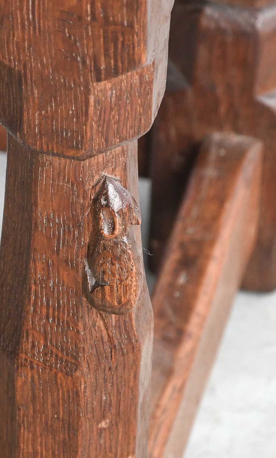 Robert Mouseman Thompson (1876-1955): An English Oak Stool, strap leather top, on four octagonal - Image 2 of 2