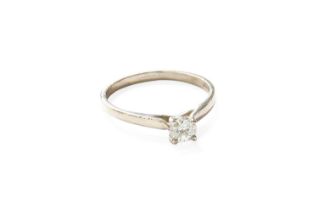 A Platinum Diamond Solitaire Ring, the round brilliant cut diamond in a four claw setting, to a