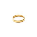 A 22 Carat Gold Band Ring, finger size Q Gross weight 6.0 grams.