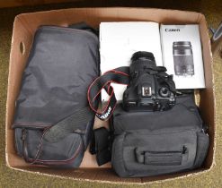 A Canon EOS 1200D Camera, with EF lenses 75-300mm and 15-55mm, together with various accessories, as