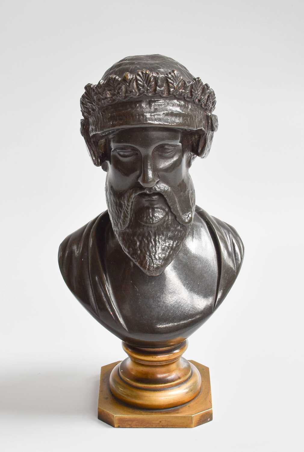 A Patinated Bronze Bust of an Assyrian, raised on gilt socle, 17cm high