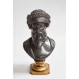 A Patinated Bronze Bust of an Assyrian, raised on gilt socle, 17cm high