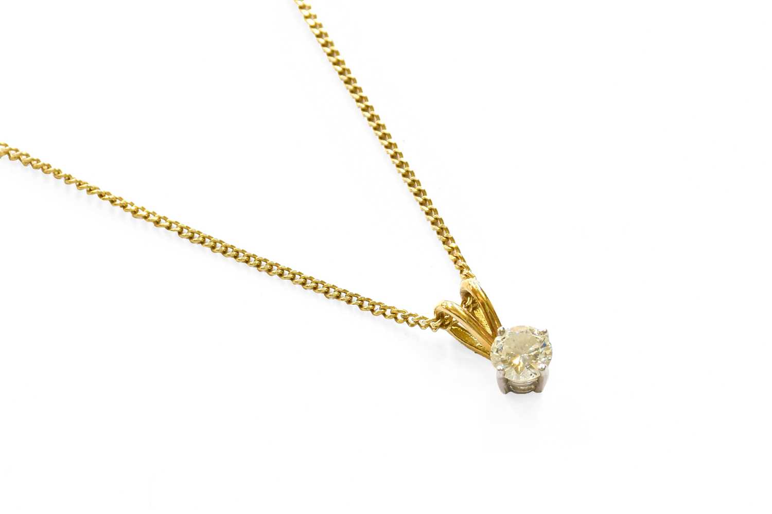 An 18 Carat Gold Diamond Solitaire Pendant on Chain, the round brilliant cut diamond in a white claw