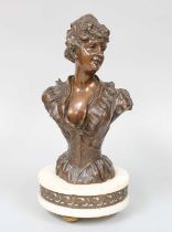 An Art Nouveau Patinated Bronze Bust of a Girl, on later alabaster plinth and gilt toupie feet, 27cm