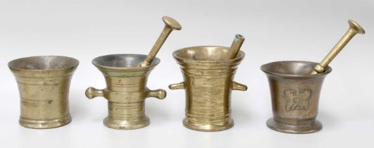 Four 17th Century and Later Bronze Mortars, with three associated pestles, tallest 13cm high