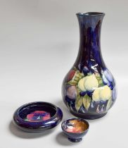A Willam Moorcroft Wisteria Pattern Vase (restored), 23.5cm high, a pansie pattern bowl, 11cm a