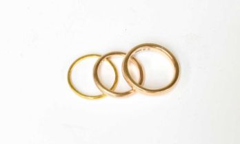 A 22 Carat Gold Band Ring, finger size M; and Two 9 Carat Gold Band Rings, finger sizes J and N1/2