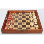 Jacques & Son, London, an "In Statu Quo" travelling Chess Board with bone and stained bone pieces (