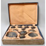 A Cased Japanese Satsuma Earthenware Tea Service, Taisho period, in fitted case, matt black ground