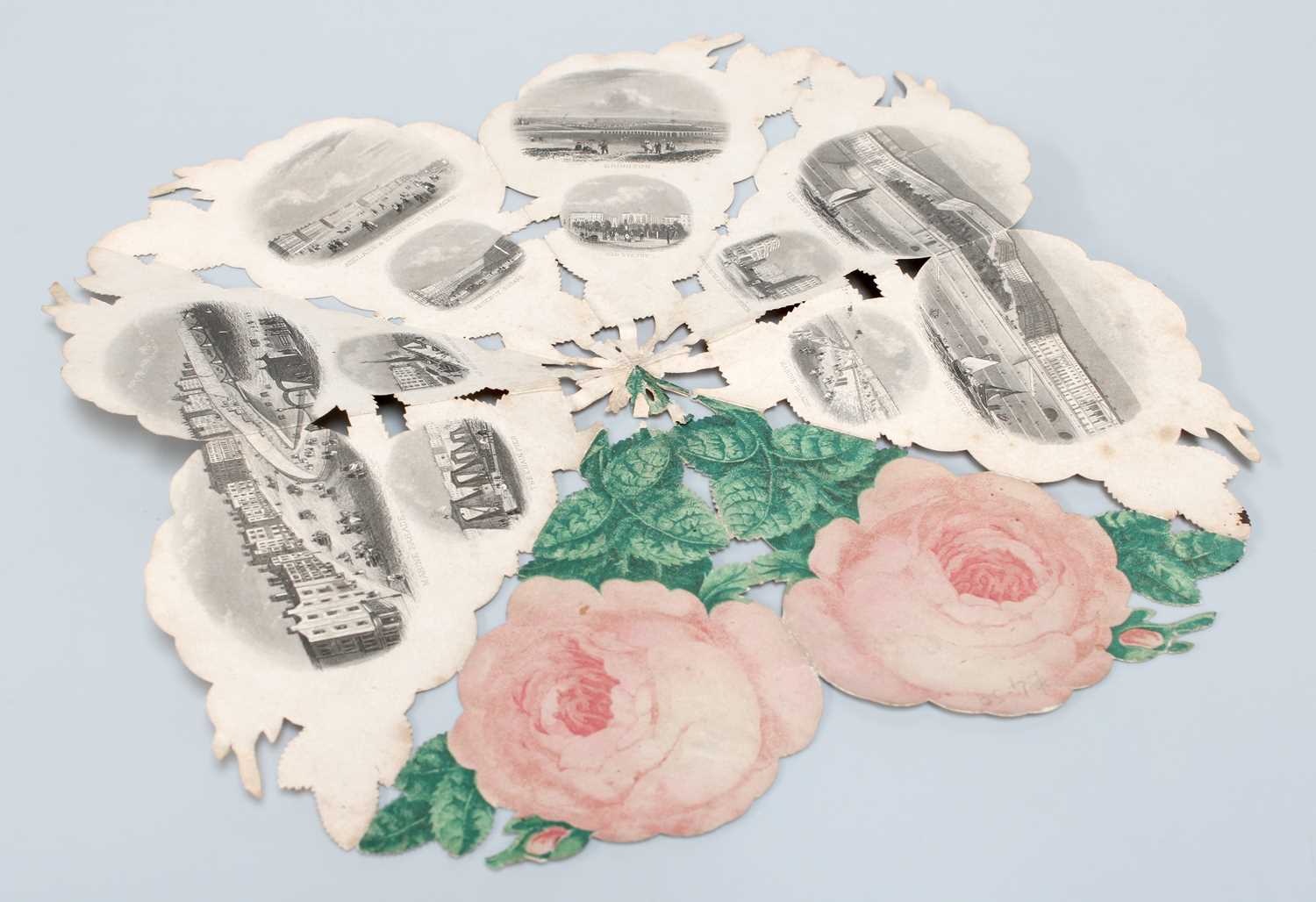 Victorian Folding Paper Souvenir, folds to form a rose, opens to reveal small engraved vignettes