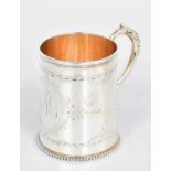 A Victorian Silver Christening-Mug, by Alexander Macrae, London, 1868, tapering and with leaf-capped