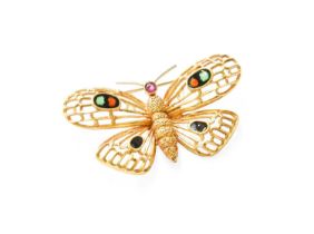 An Enamel Butterfly Brooch, with applied plaque to the reverse stamped '18K', measures 4.0cm by 2.