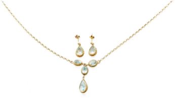 A 9 Carat Gold Blue Topaz Necklace, two oval cut blue topaz suspend a single oval cut blue topaz