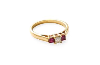 A Ruby and Diamond Three Stone Ring, the princess cut diamond flanked by square cut rubies, in