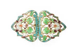 An Enamel Belt Buckle, of floral design, enamelled in green, blue and purple tones The buckle is