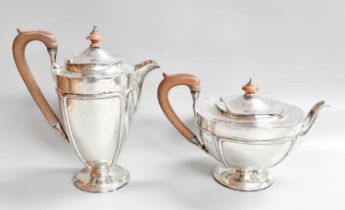 A George V Silver Teapot and Hot-Water Jug, by Fattorini and Sons Ltd., Birmingham, 1917, each