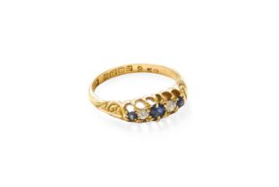 An 18 Carat Gold Sapphire and Diamond Five Stone Ring, three graduated round cut sapphires alternate