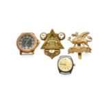 A First World War "On War Service" Badge; a brass cap badge to the Buffs; a silver wristwatch -