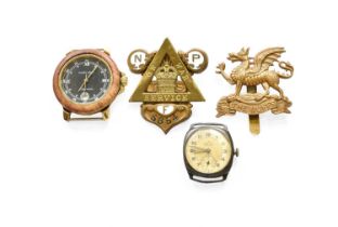 A First World War "On War Service" Badge; a brass cap badge to the Buffs; a silver wristwatch -