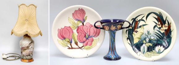 Two Moorcroft Plates, Cobridge lamp and a Moorcroft twin-handled comport (lacking cover) (4)