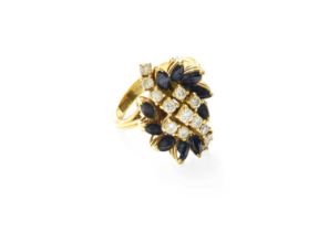 An 18 Carat Gold Sapphire and Diamond Cluster Ring, a diagonal row of round brilliant cut diamonds