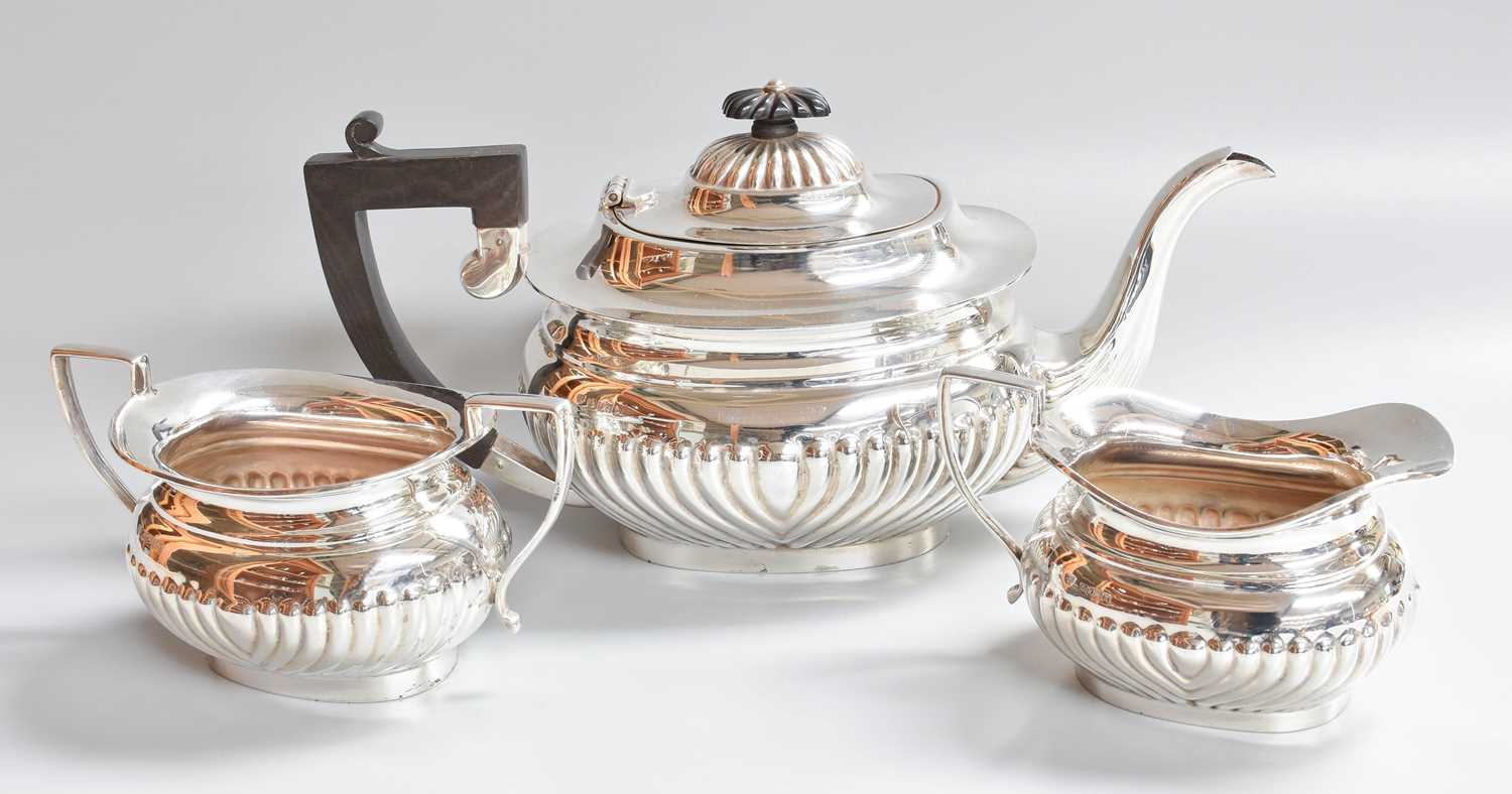 A Three-Piece Elizabeth II Silver Tea-Service, by J. B. Chatterley and Sons Ltd., Birmingham,