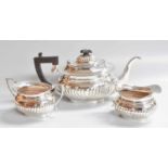 A Three-Piece Elizabeth II Silver Tea-Service, by J. B. Chatterley and Sons Ltd., Birmingham,