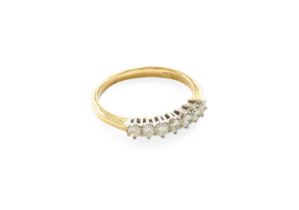 An 18 Carat Gold Diamond Seven Stone Ring, the round brilliant cut diamonds in white claw