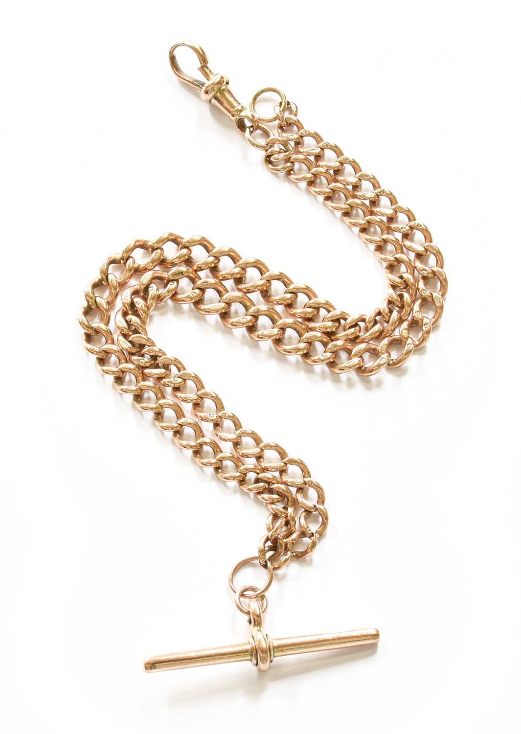 A Graduated Curb Link Watch Chain, each link stamped ‘9’ and ‘.375’, with a 9 carat gold T-bar,