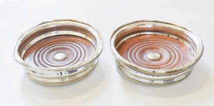 A Pair of George IV Silver Wine-Coasters, Possibly by Rebecca Emes and Edward Barnard, London, 1825,