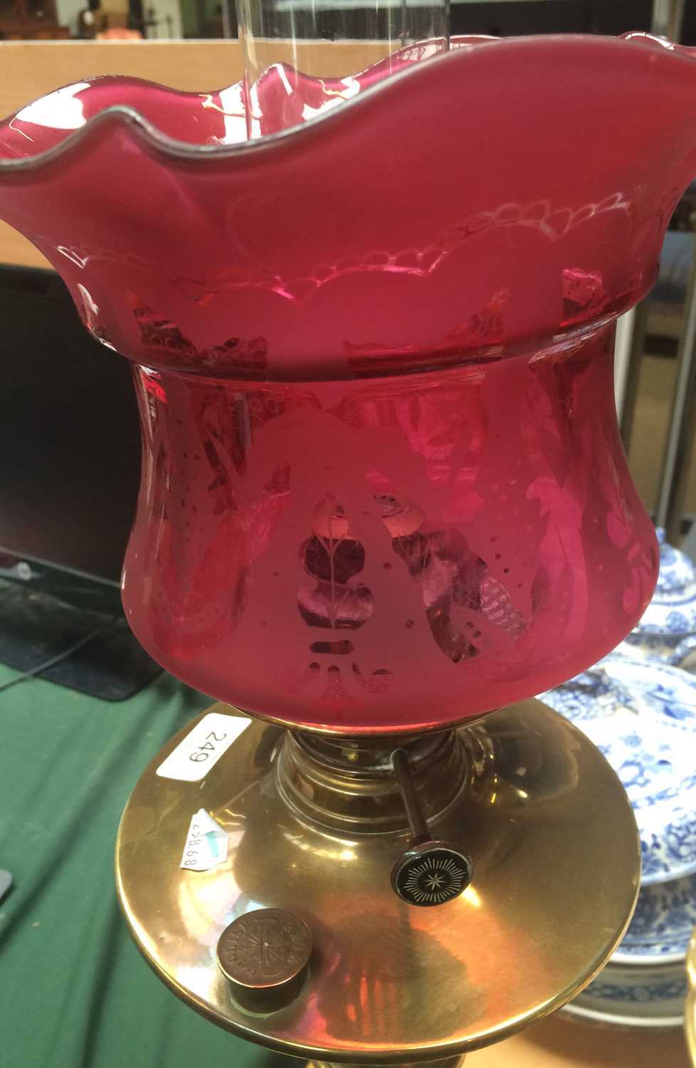 A Victorian Brass Based Oil Lamp, with etched cranberry glass shade and on fluted pedestal Shade - Image 3 of 6