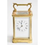 A Brass Carriage Timepiece, 15cm over handle, and a Victorian black slate and marble mantel