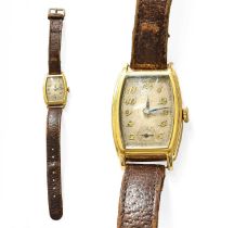 An 18 Carat Gold Tonneau Shaped Wristwatch Winding smoothly and in going order Gross weight - 23.9