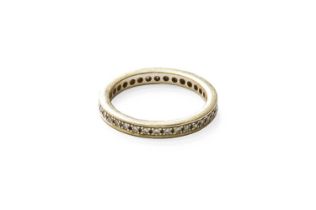 A Diamond Eternity Ring, the round brilliant cut diamonds in white claw and channel settings,