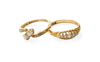An 18 Carat Gold Diamond Two Stone Twist Ring, the old cut diamonds in yellow claw settings, to a