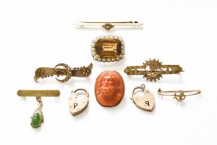 A Quantity of Jewellery, comprising of seven brooches, including a coral example, a citrine and