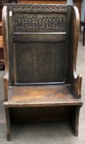 A 17th Century Style Carved Oak Single Seat Settle, of pegged construction and with panelled back
